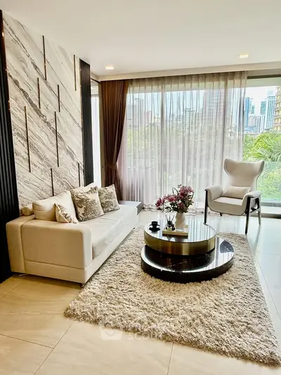 Luxurious living room with modern decor, large windows, and city view, perfect for urban living.