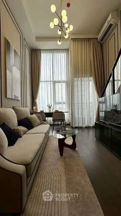 Luxurious high-ceiling living room with elegant decor and modern lighting