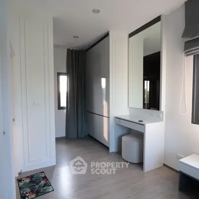 Modern bedroom with sleek design and ample natural light