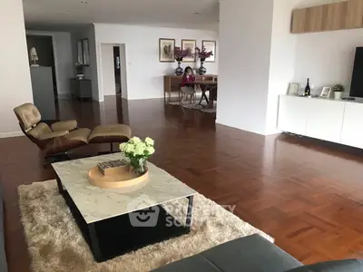 Spacious living room with elegant decor and hardwood floors