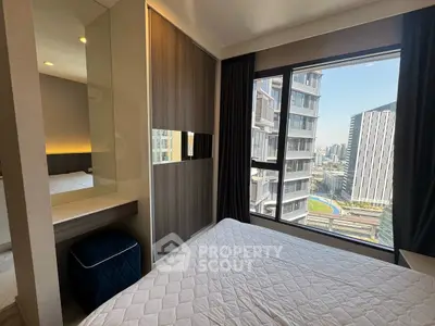 Modern bedroom with city view and stylish decor in high-rise apartment