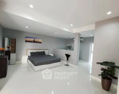 Spacious modern bedroom with sleek design and elegant decor