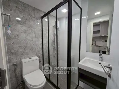 Modern bathroom with sleek shower enclosure and stylish fixtures