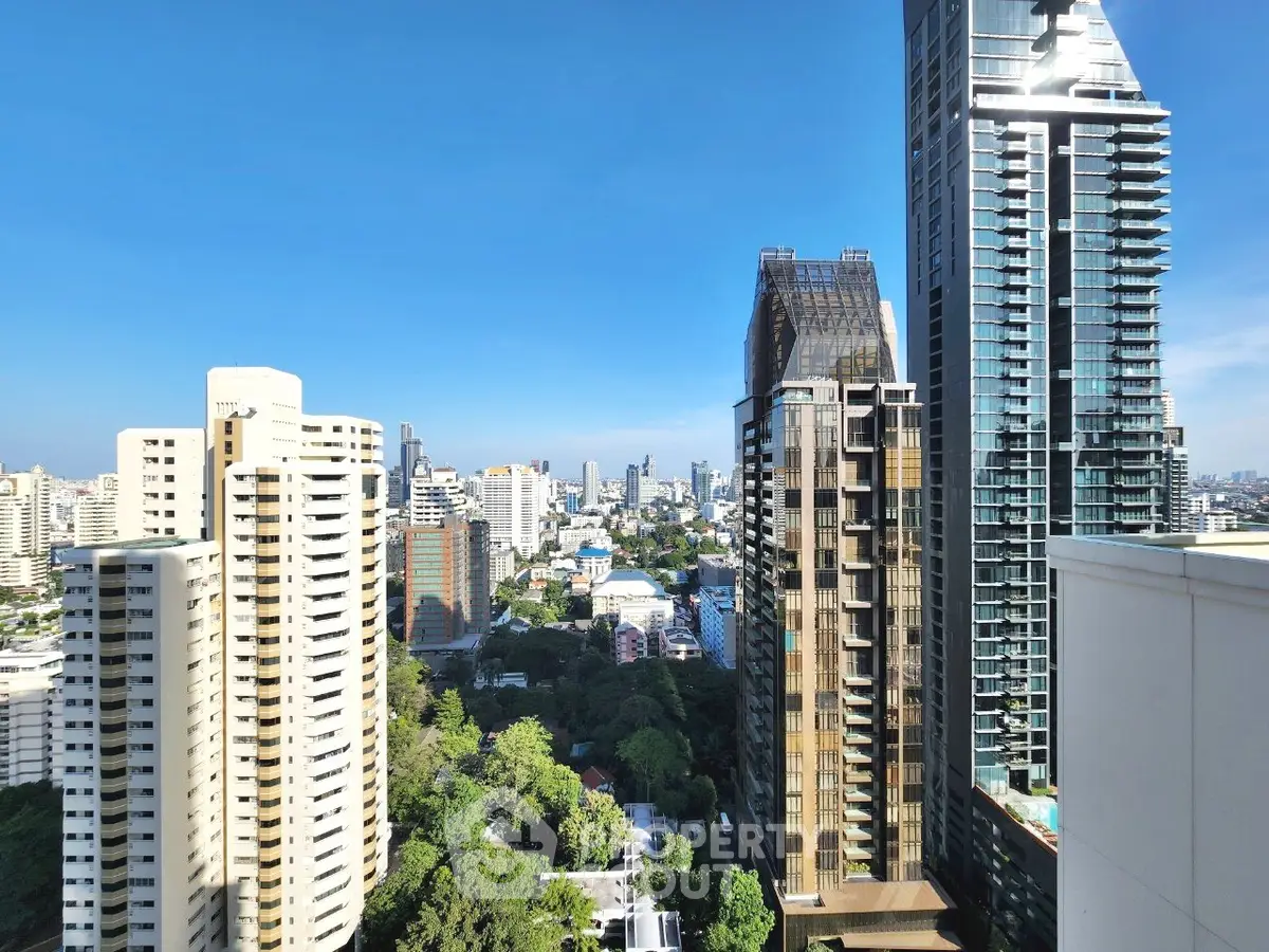 Stunning cityscape view from high-rise apartment balcony in urban skyline.