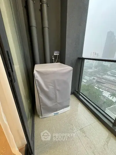 Modern balcony with city view and covered air conditioning unit