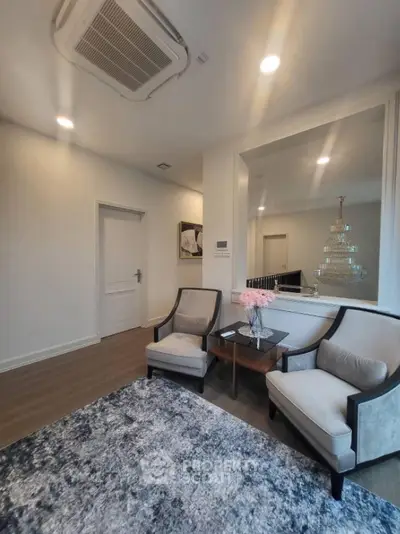 Elegant living room with modern decor and plush seating