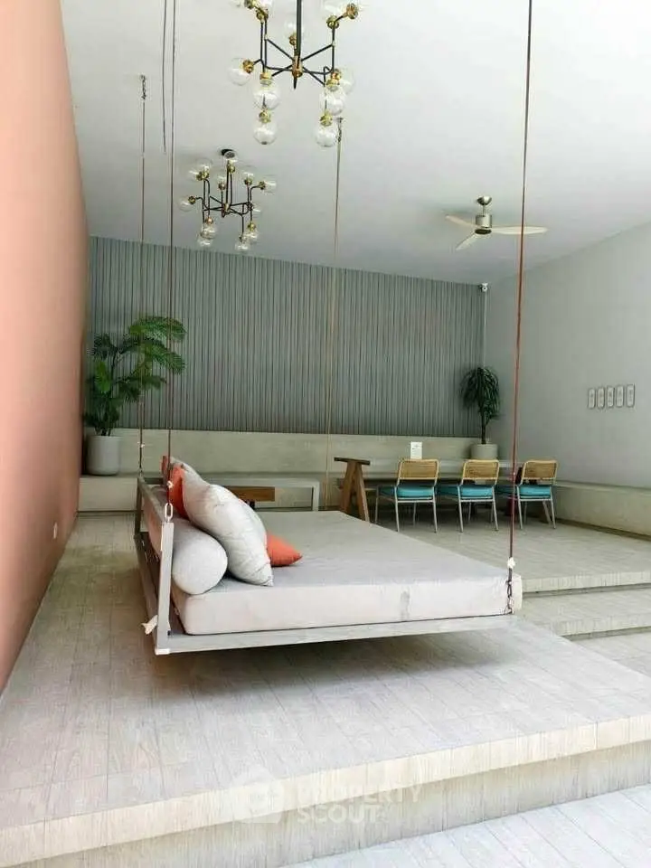 Modern living room with suspended daybed and stylish decor