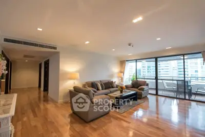 Spacious living room with elegant decor and large balcony view in modern apartment.