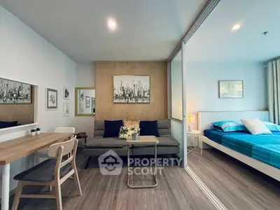 Modern studio apartment with stylish decor and cozy bedroom