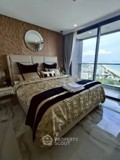 Luxurious bedroom with stunning ocean view and elegant decor