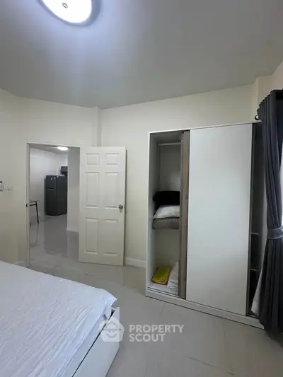 Modern bedroom with sliding wardrobe and minimalist decor