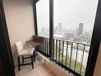 Chic balcony with stunning city view, perfect for relaxation and enjoying urban skyline.
