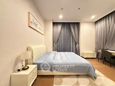 Luxurious bedroom with elegant decor and large window in modern apartment