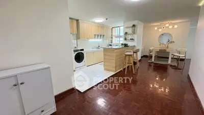 Spacious open-plan kitchen and dining area with modern appliances and stylish decor.