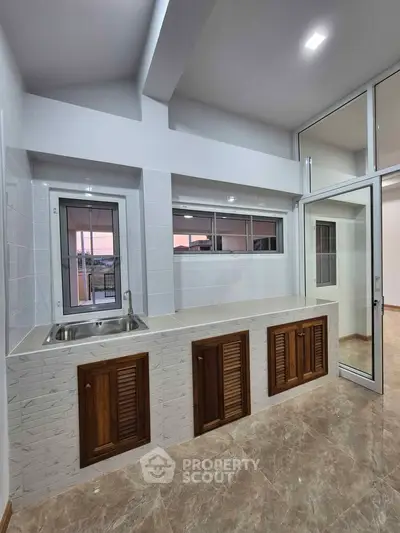 Modern kitchen with sleek design and ample natural light