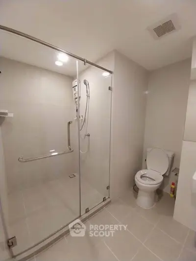 Modern bathroom with glass shower and sleek fixtures