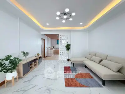 Modern living room with stylish lighting and open kitchen layout