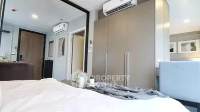 Modern bedroom with sleek design and air conditioning unit