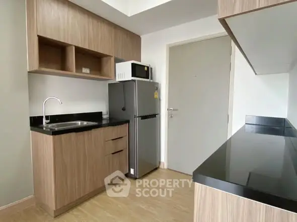 Modern kitchen with sleek cabinetry and stainless steel appliances