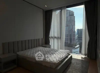 Luxurious bedroom with stunning city view in modern high-rise apartment