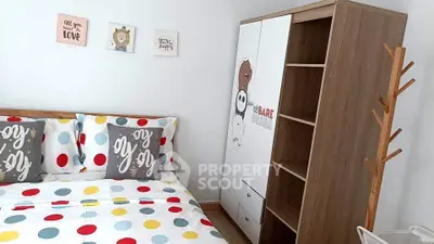 Charming bedroom with colorful polka dot bedding and stylish wooden wardrobe, perfect for cozy living.