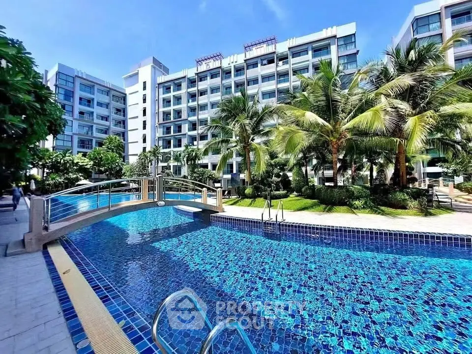 Luxurious apartment complex with stunning pool and lush gardens