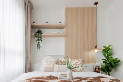 Modern bedroom with stylish decor and natural light