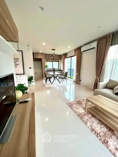 Spacious modern living room with elegant decor and natural light