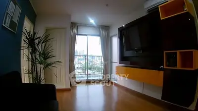 Modern living room with large window and stylish entertainment unit