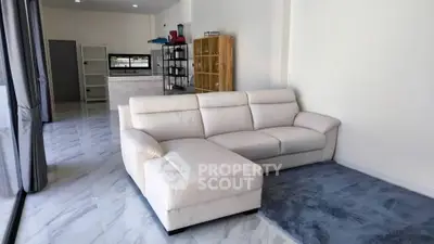 Spacious modern living room with elegant white sofa and marble flooring