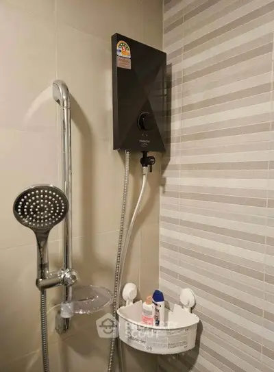 Modern bathroom with sleek showerhead and water heater, featuring stylish tile design.