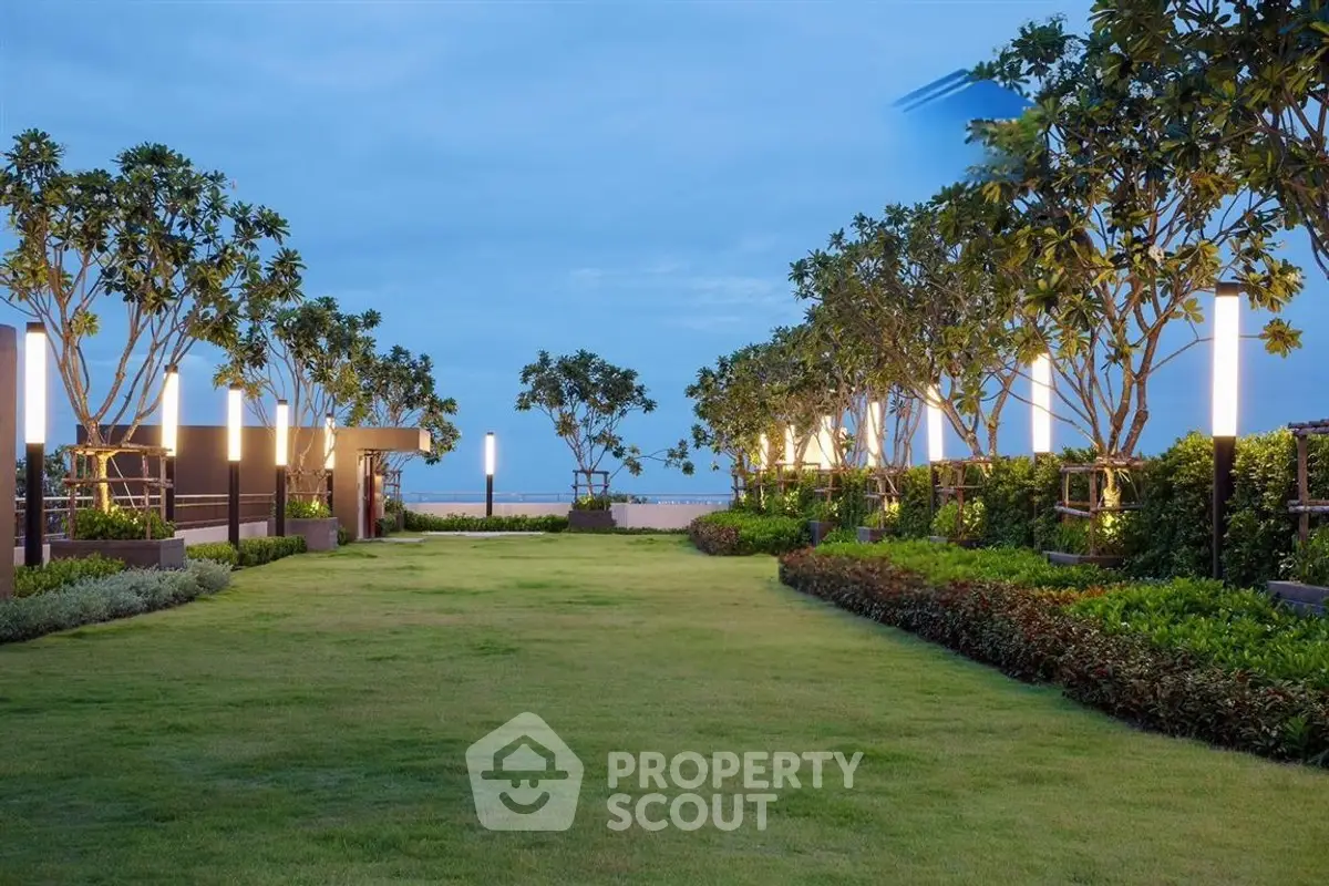 Luxurious rooftop garden with lush greenery and ambient lighting, perfect for relaxation and entertainment.