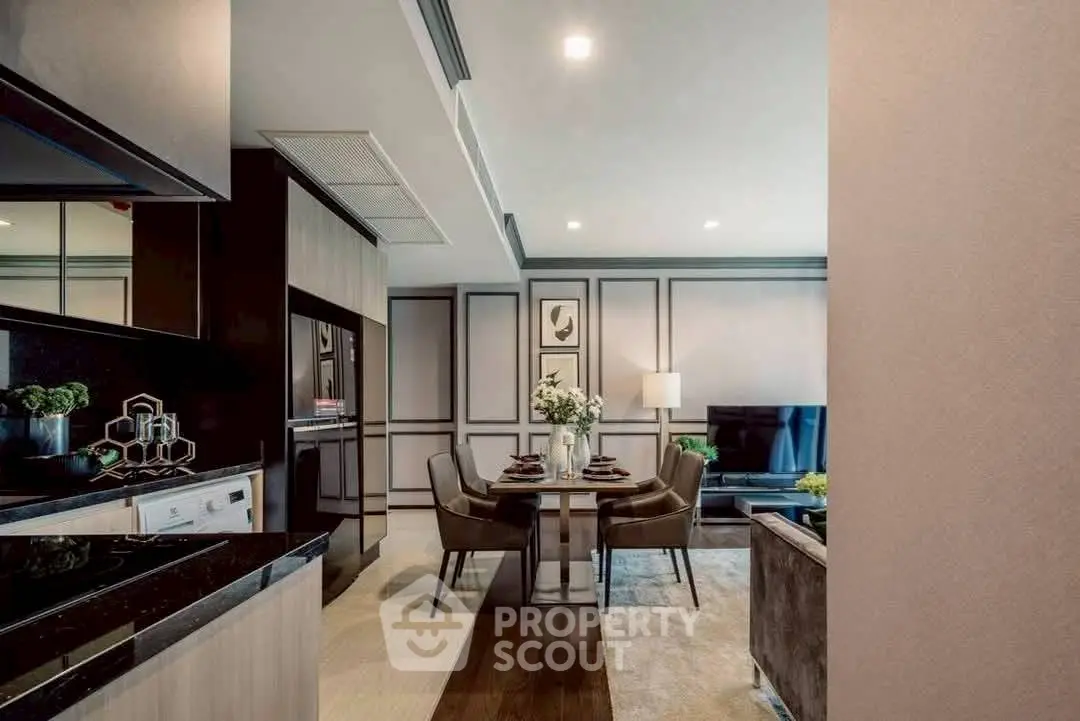 Modern open-layout kitchen and living room with elegant dining area and stylish decor.