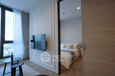 Modern apartment interior with stylish living room and cozy bedroom view.