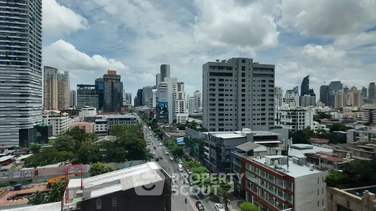 Stunning cityscape view showcasing modern high-rise buildings and bustling urban streets.