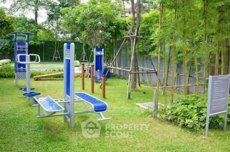 Outdoor gym equipment in a lush green garden setting, perfect for fitness enthusiasts.