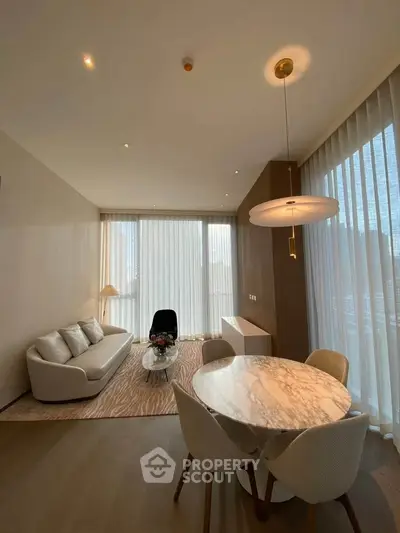 Elegant modern living room with marble dining table and floor-to-ceiling windows