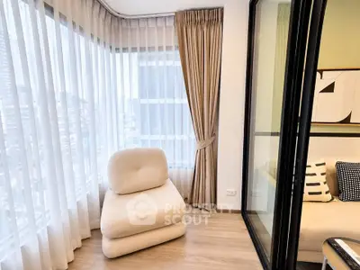 Modern corner unit with floor-to-ceiling windows and cozy seating area.