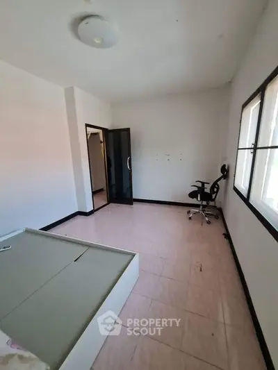 Spacious bedroom with minimalist design and natural light