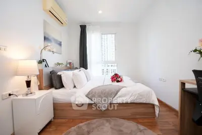 Cozy and modern bedroom with wooden flooring and natural light