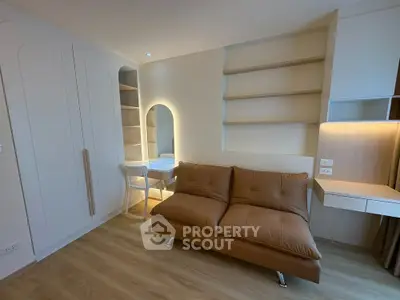 Modern living room with sleek sofa and built-in shelves