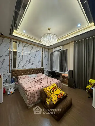 Luxurious bedroom with elegant chandelier and modern decor