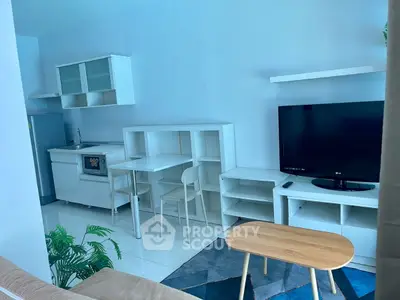 Modern living room with sleek furniture and open kitchen layout