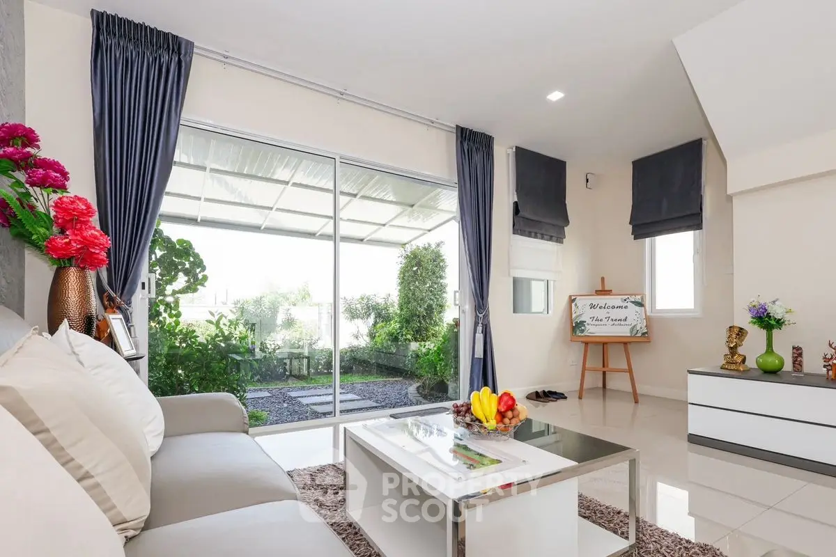 Modern living room with garden view and elegant decor