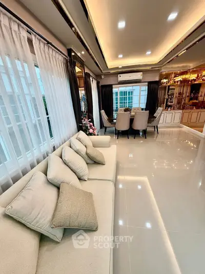 Luxurious living room with elegant dining area and modern decor