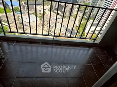 High-rise balcony with cityscape view and tiled flooring