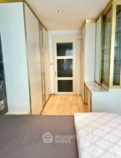 Modern bedroom with stylish built-in storage and elegant decor