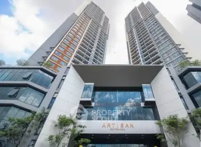 Stunning modern high-rise building with sleek architectural design and expansive glass windows.