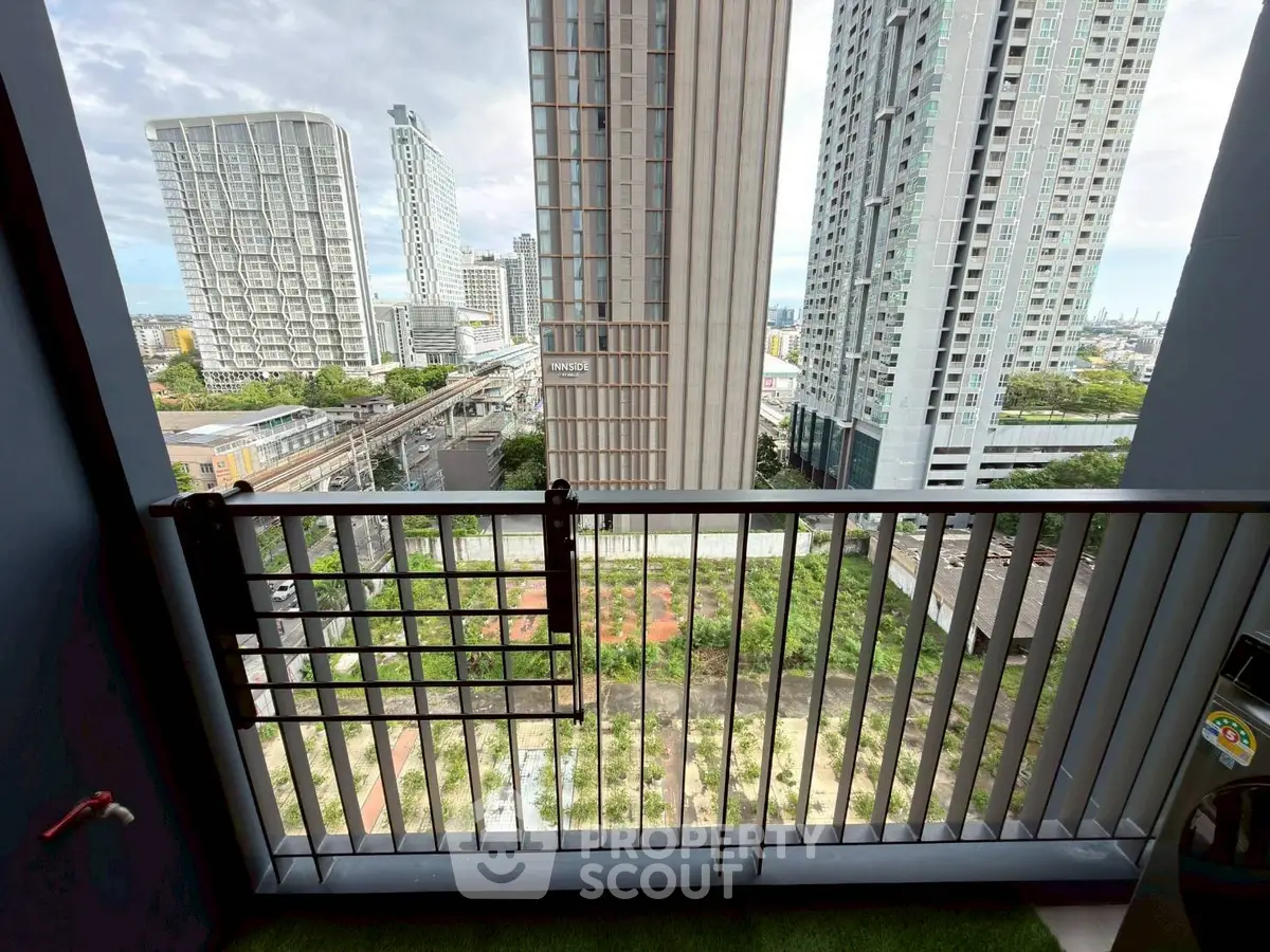 Stunning cityscape view from a high-rise balcony, perfect for urban living.