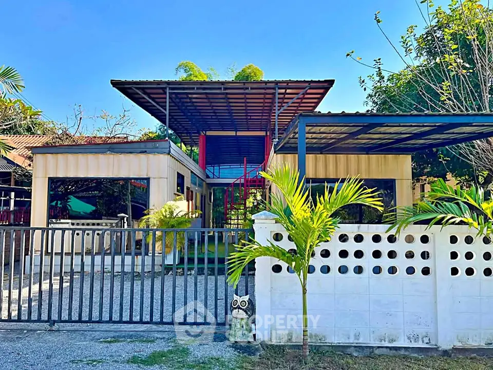 Modern architectural home with sleek design and lush greenery